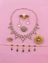 Selection of Victorian jewellery: tourmaline and split pearl fringe necklace; rose-cut diamond oval brooch; opal and diamond necklace; cabochon amethyst star brooch; Essex crystal of snarling tiger