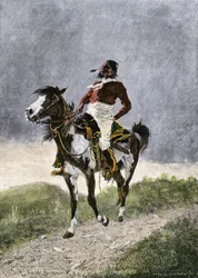 A brave Comanche, traveling on horseback in the southern prairies (Texas, Oklahoma, USA), around 1800. Lithograph