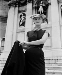 A model wearing Christian Dior fashions in Venice, 3rd June 1951: Outside La Salute