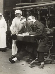 A Nurse Translating the News for the Wounded Soldiers of the Allied Forces