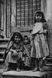 Africa. Mendicant street Arabs outside a mosque in Tunis. 1920