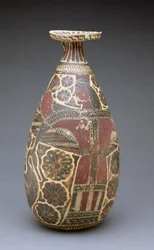Corinthian black-figured alabastron, with a winged 