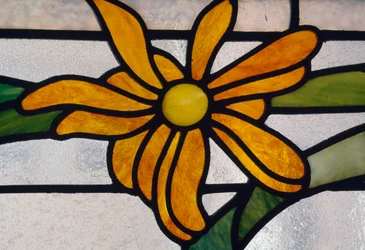 Handcrafted stained glass window with floral decoration (detail)
