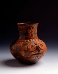 Pre-Columbian art, Maya civilization, initial Postclassic period: clay jar representing the god Tlaloc. From Asunción Mita, Jutiapa, Guatemala. Dimensions: h. 14 x diam. 7.6 cm. Guatemala, National Museum of Archaeology and Ethnology