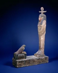 Ptah-Soker-Osiris figure standing on a box plinth facing a sarcophagus with a Horus falcon, funerary object, Egyptian, Ptolemaic Period, c. 200 BC