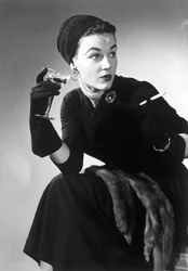 Woman in evening wear with cocktail and cigarette