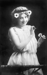Woman Pulling Petals from a Flower: 