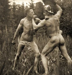 Fighting battle pose with a Roman Helmet, c.1910