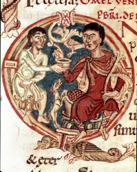 A servant serving to drink to the lord