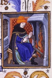 Allegoric representation of February. A man gets warm in front of his fireplace. Miniature of a 14th century manuscript