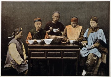 Chinese family eating - photochrome, late 19th century