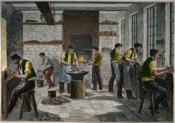 Cutlery workshop in France in the 19th century. Engraving from 1885 in 