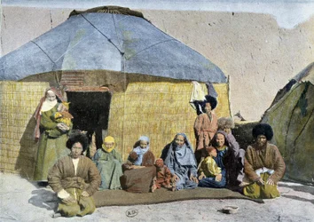 Group of Tekes (Russian nomads) in front of their yurt, late 19th century