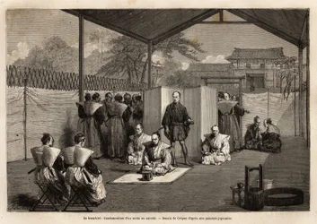 Hara-kiri: condemnation of a nobleman to ritual suicide; condemned, kneeling on the white mat, he will use the knife to open his belly, then the samurai standing behind him decapitates him with a sword. Engraving illustrating a voyage to Japan, 1863-1864