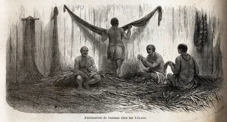 The making of hammocks fillets among the Yahua Indians of Peru, from thin threads of palm chambira tressees. Engraving to illustrate the voyage from the Pacific Ocean to the Atlantic Ocean, through South America, in 1848-1860 by Paul Marcoy, in 