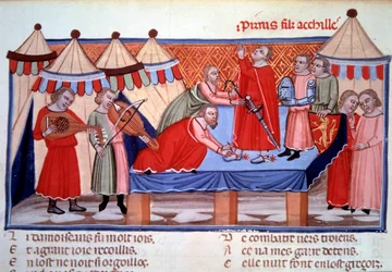 The knighting of Pyrrhus, son of Achilles. Miniature taken from “Le Roman de Troie” by Benoît de Sainte-Maure, a Norman poet of the late 12th century, produced around 1160-1170 for Eleanor of Aquitaine. Approximately 1300. Paris, Bibliothèque nationale