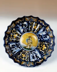 Godronnee faience cup decoree of an angelot