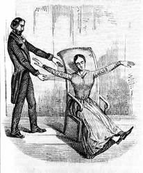 Hypnosis: a man practicing hypnosis on a cataleptic woman.