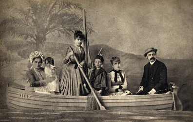 Portrait of a family with a photographer, staged in a boat. Photography, late 19th century, Paris. Coll. Selva