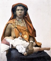 Young Berber woman breastfeeding a baby