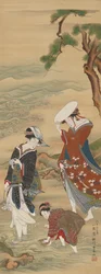 Two women and a girl on the seashore