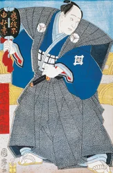 Japanese actor in traditional kimono with fan