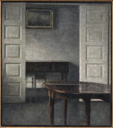 Room. The double doors stand open to a room behind with a closed piano