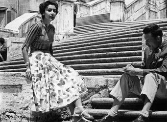 A Young Woman and Man Relaxing on the Spanish Steps