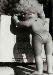 Abandoned Doll Next to a Box
