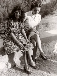 Two Girls Seated on a Wall, Italy, c.1940