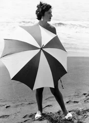 Woman with Umbrella on Beach, c.1960