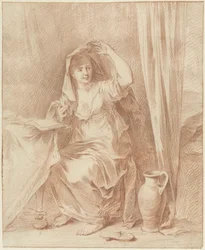 Woman Sitting at a Table Behind a Book