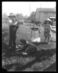 Children with a Dog and Puppy Gathered Around a Rope Swing at the McCready Farm, Pennsylvania