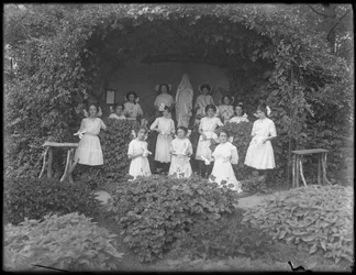 Graduating Class of Girls from the Roman Catholic Orphan Asylum Posed Before the Grotto with Their Diplomas