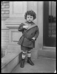 Little Boy in Sailor Suit on Front Stoop of Vermilyea Avenue Apartment Building