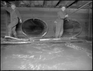 Men Working in the W. 129th Street Sewer, New York