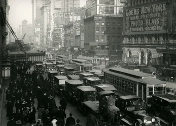 Times Square, crowded with cars, buses and people, c.1917