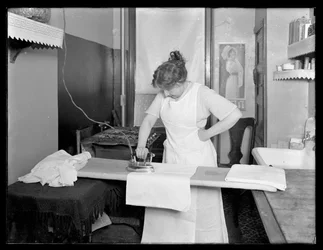 Unidentified Woman Demonstrating the Use of an Electric Iron