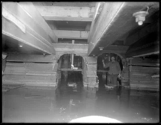 Worker inside the W. 129th Street sewer, New York, c.1911