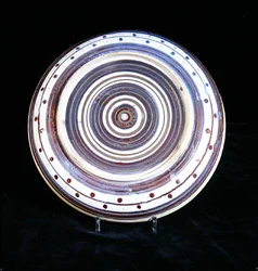 Charger with concentric circles of white, blue, purple and gold lustre