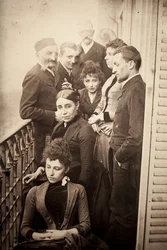 The Claudel family, Jessie Lipscomb, Ferdinand de Massary and his father on the balcony of the apartment at 31 boulevard de Port Royal. (In the foreground: Louise (b. 1866), behind her Madame Claudel (b. Louise Athanaise Brains in 1840) and Camille