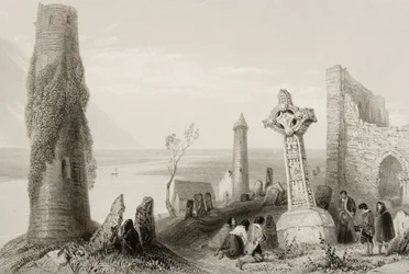The Ancient Cross and Round Tower at Clonmacnois, County Offaly, Ireland, from 