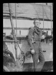An unidentified naval officer standing by the belaying pin rail on the port side of the 80-gun three-decker HMS 