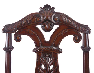 (Detail) of a pair of George II hall chairs, executed by James Moore the Younger