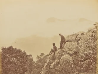 Men Standing on Rock Formations
