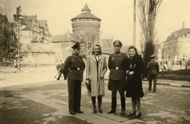 World War II (1939-1945): Two German soldiers posing with their companion or spouse in the city of Tours, France