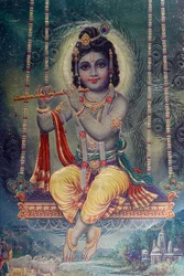 Lord Krishna with flute. Hindu God.