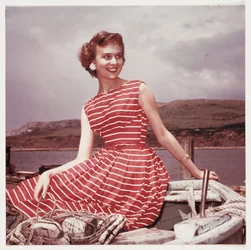 Woman wearing a summer dress, c 1950s