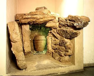 Reconstruction of an Etruscan tomb with an urn